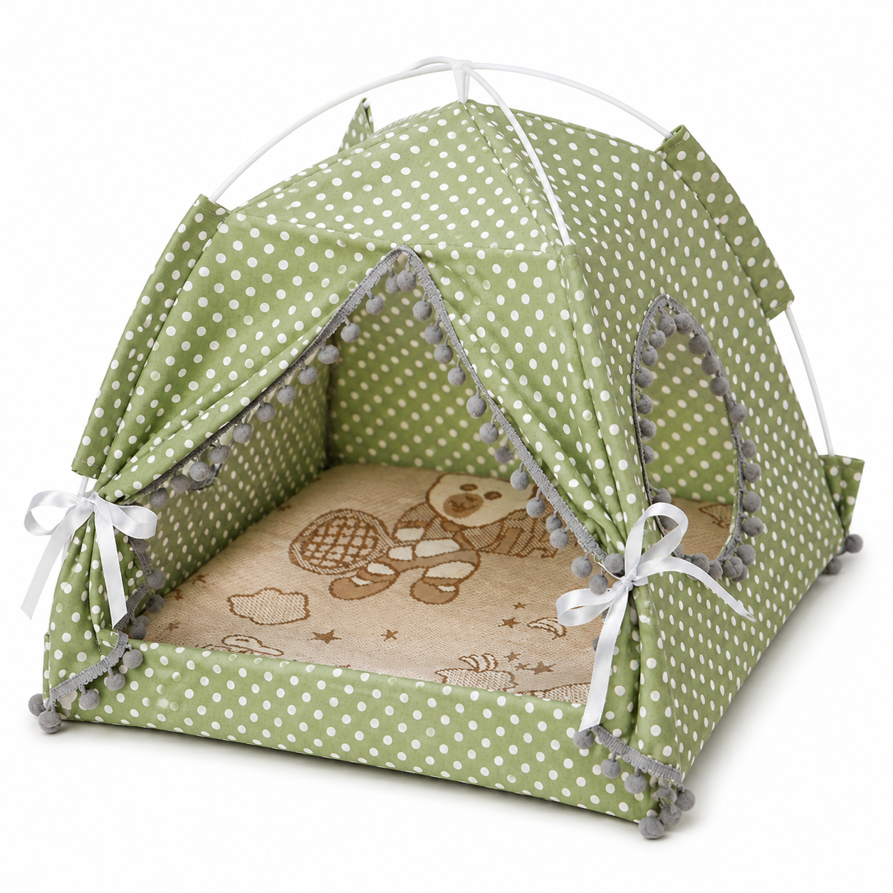 Green polka dot pet tent with pom-pom trim on a white background